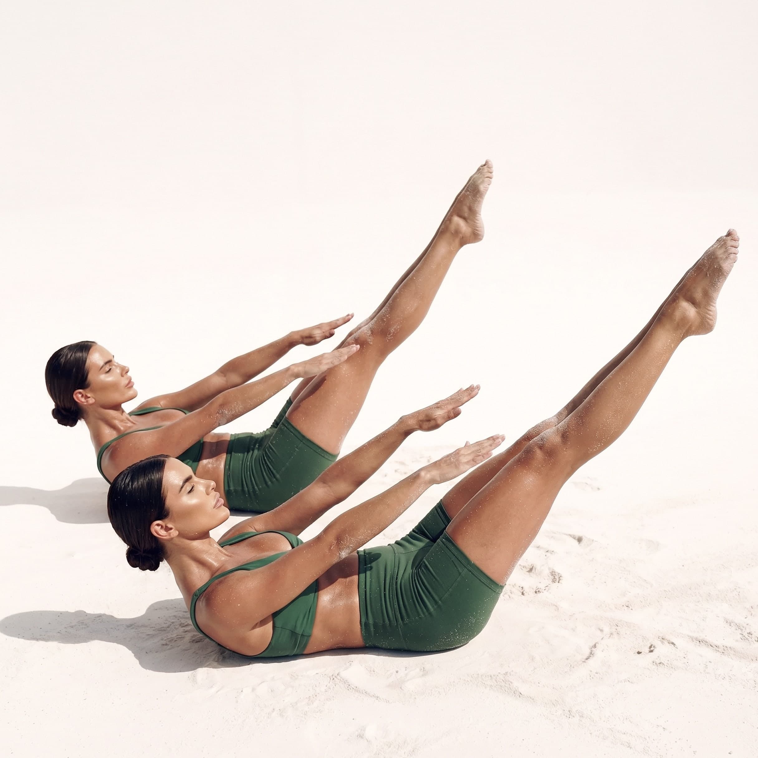 Two women performing core-focused Mat Pilates at MokoBoko boutique studio in Saldanha, Lisbon
