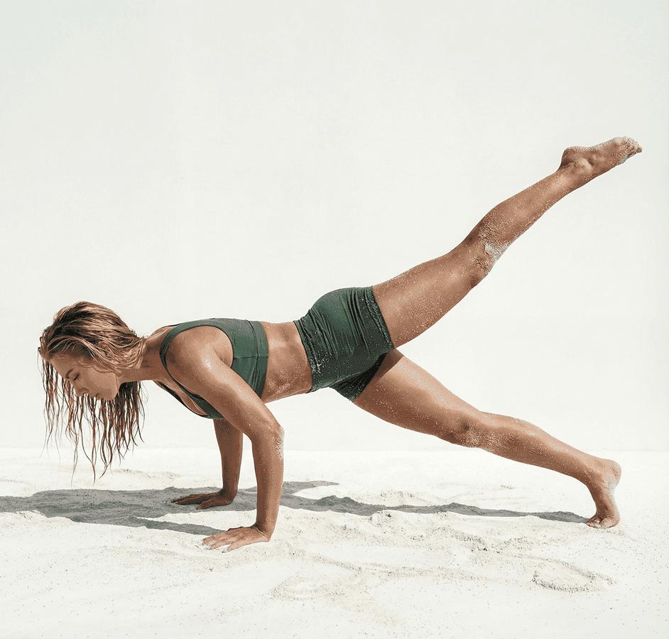 Advanced Mat Pilates movement showing a single-leg lift plank to challenge full-body stability.
