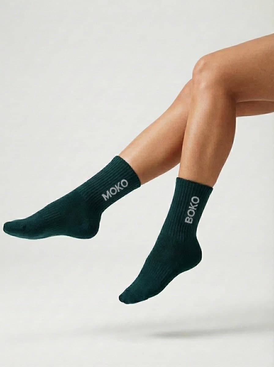 Legs in dark green MokoBoko grip socks