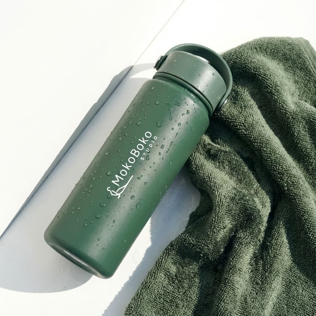 MokoBoko branded green reusable water bottle—fitness accessories for functional training in Lisbon.